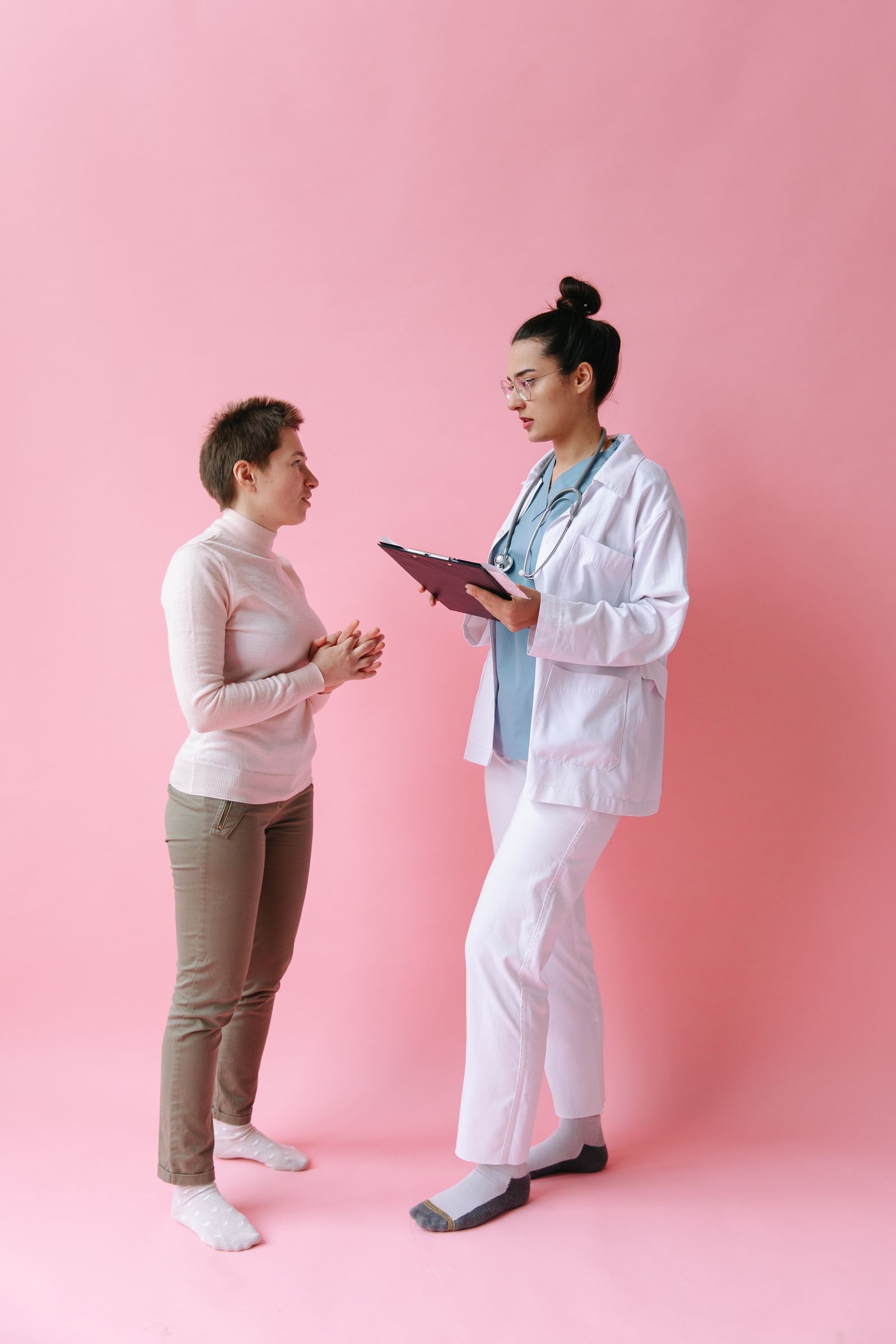 A clinician and patient discussing medical care