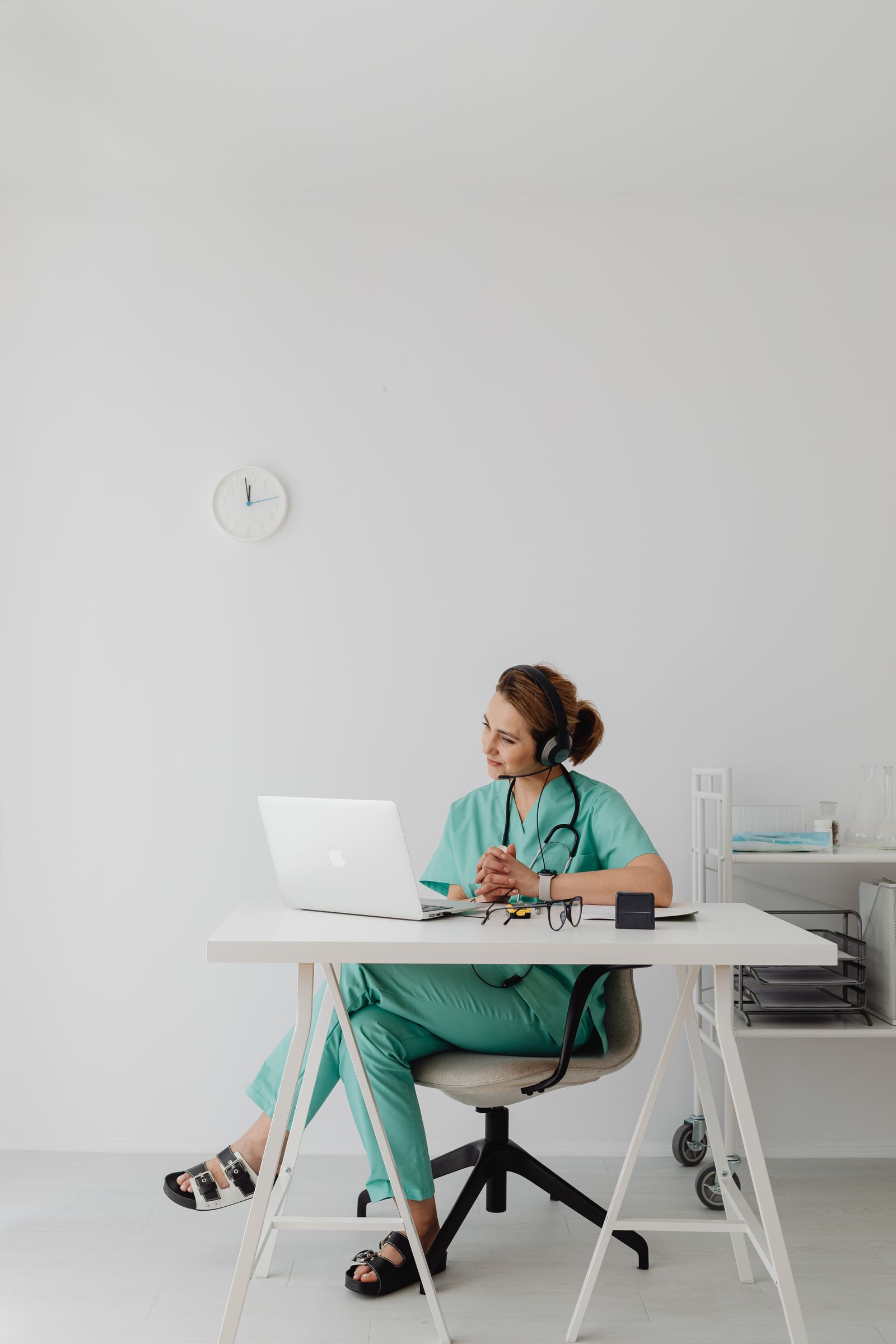 A clinician speaking with a patient by video